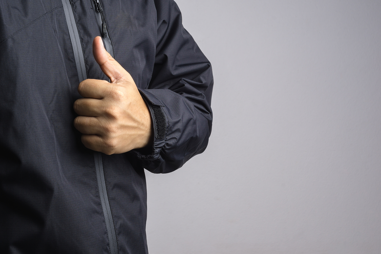 A person wearing a soft shell jacket -puffer jacket - mens softshell jacket