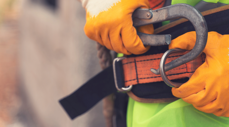 A waist belt being hooked up - waist belt - safety harness belt 