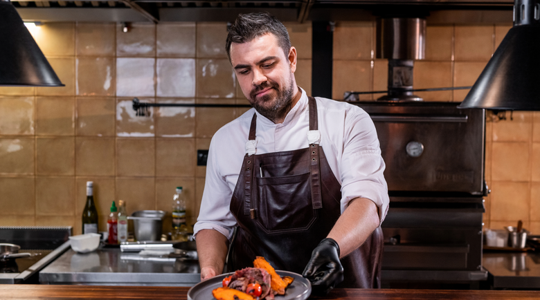 Chef wearing leather apron - leather apron - overalls and protective aprons
