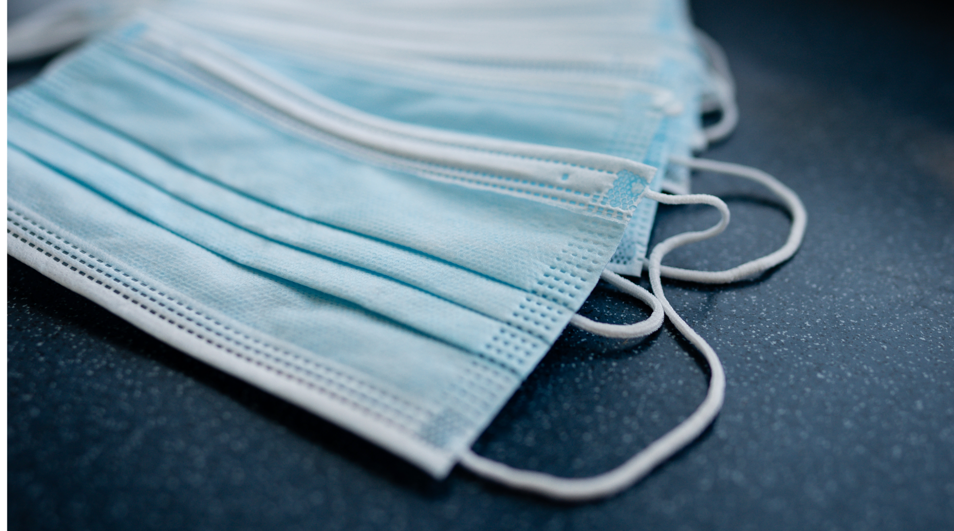 Disposable masks on counter top - disposable masks - disposable face mask