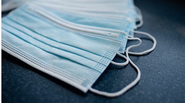 Disposable masks on counter top - disposable masks - disposable face mask