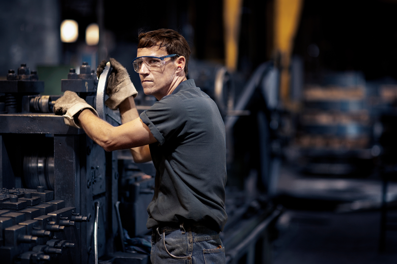 Employee wearing goat skin gloves while working - goatskin gloves - safety gloves