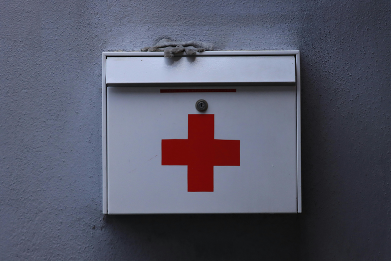 First aid kit on wall - first aid kit - first aid kits for work