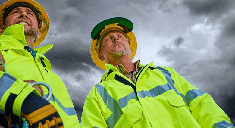 Picture-of-men-wearing-reflective-rain-coats-in-rain