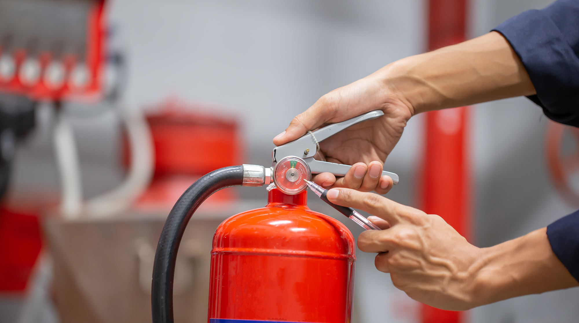 Picture-of-someone-implementing-fire-safety-procedures