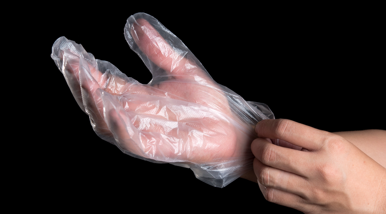 Plastic gloves being put on - plastic gloves - sanitary gloves