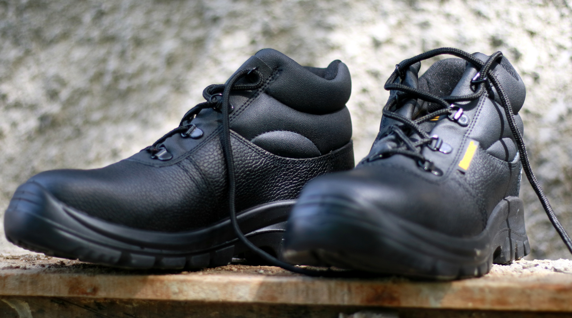 Safety shoes lying on a bench - work shoes - steel toe shoes