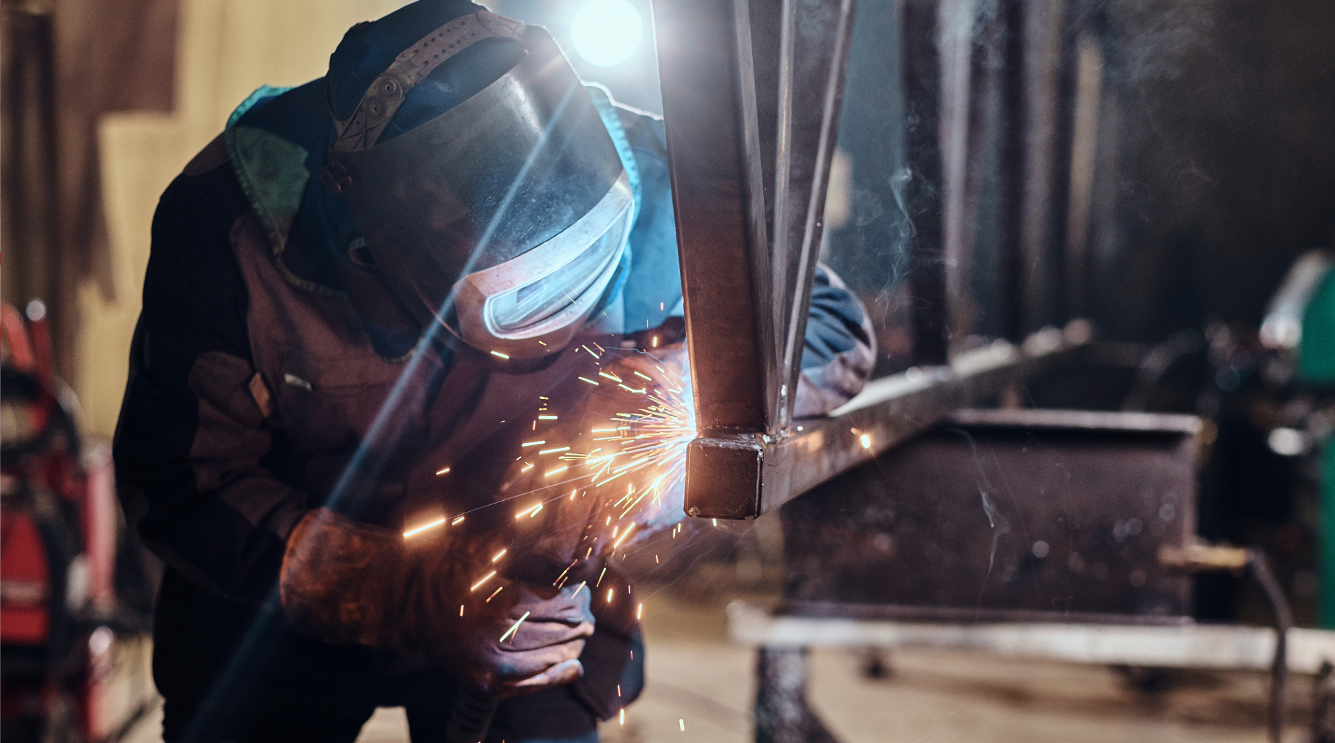 Someone welding a metal frame - welding ppe - welding protective equipment