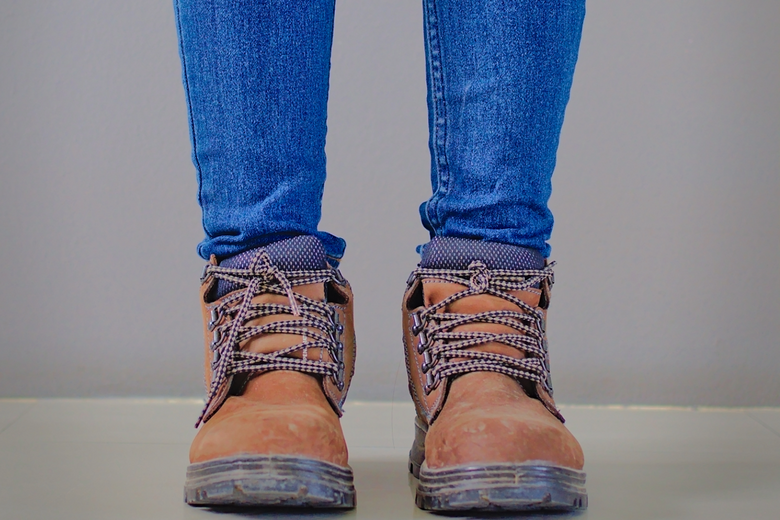 Lady wearing brown safety boots 