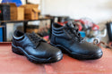 Jackal Lo Safety Shoe: Black work shoe with laces, steel toe cap, and a budget-friendly option.