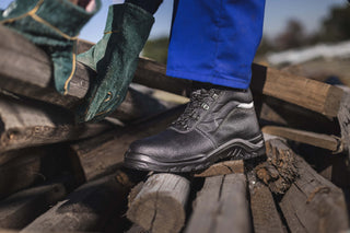 Raptor Safety Boot: Black work boot with laces, steel toe cap, and available in multiple sizes.