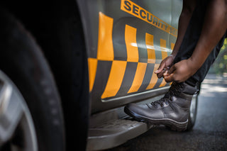 Reaction Safety Boot: Black work boot with laces, breathable mesh upper, and a steel toe cap.