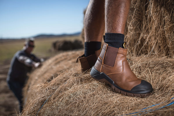 Ripsaw Safety Boot: Brown work boot with laces, full-grain leather upper, and a durable sole.