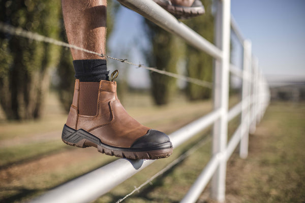 Ripsaw Safety Boot: Brown work boot with laces, full-grain leather upper, and a durable sole.