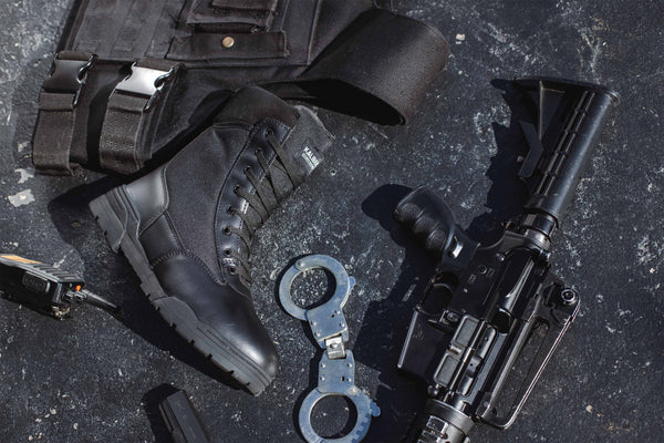 Tactical Safety Boot: Black work boot with laces, rubber outsole, and a padded collar for comfort.