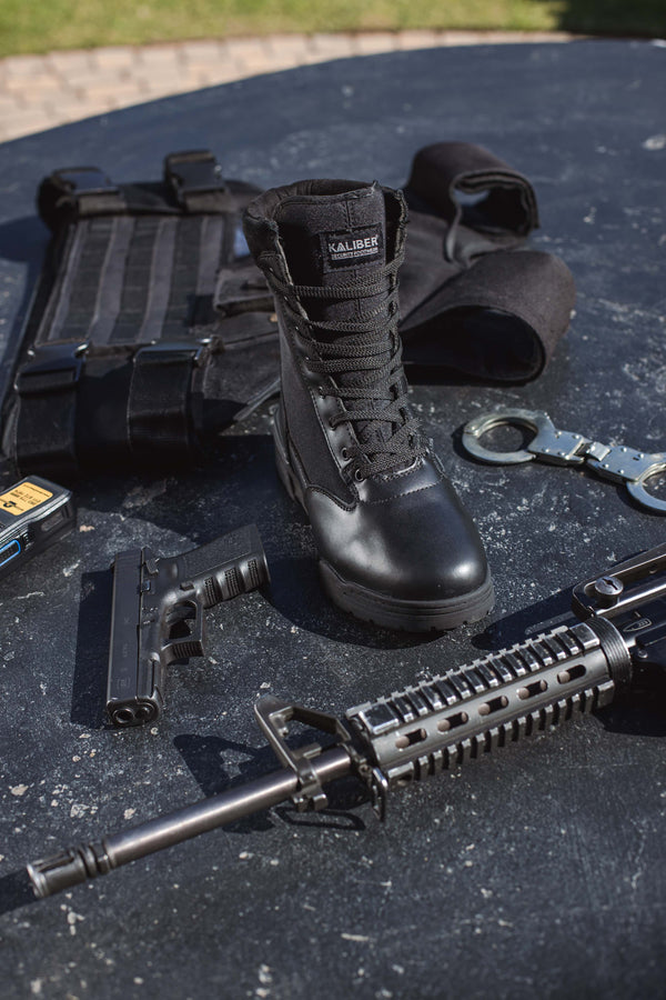 Tactical Safety Boot: Black work boot with laces, rubber outsole, and a padded collar for comfort.