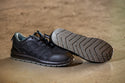 Velocity Shoe: Grey breathable safety shoe with laces and a steel toe cap.